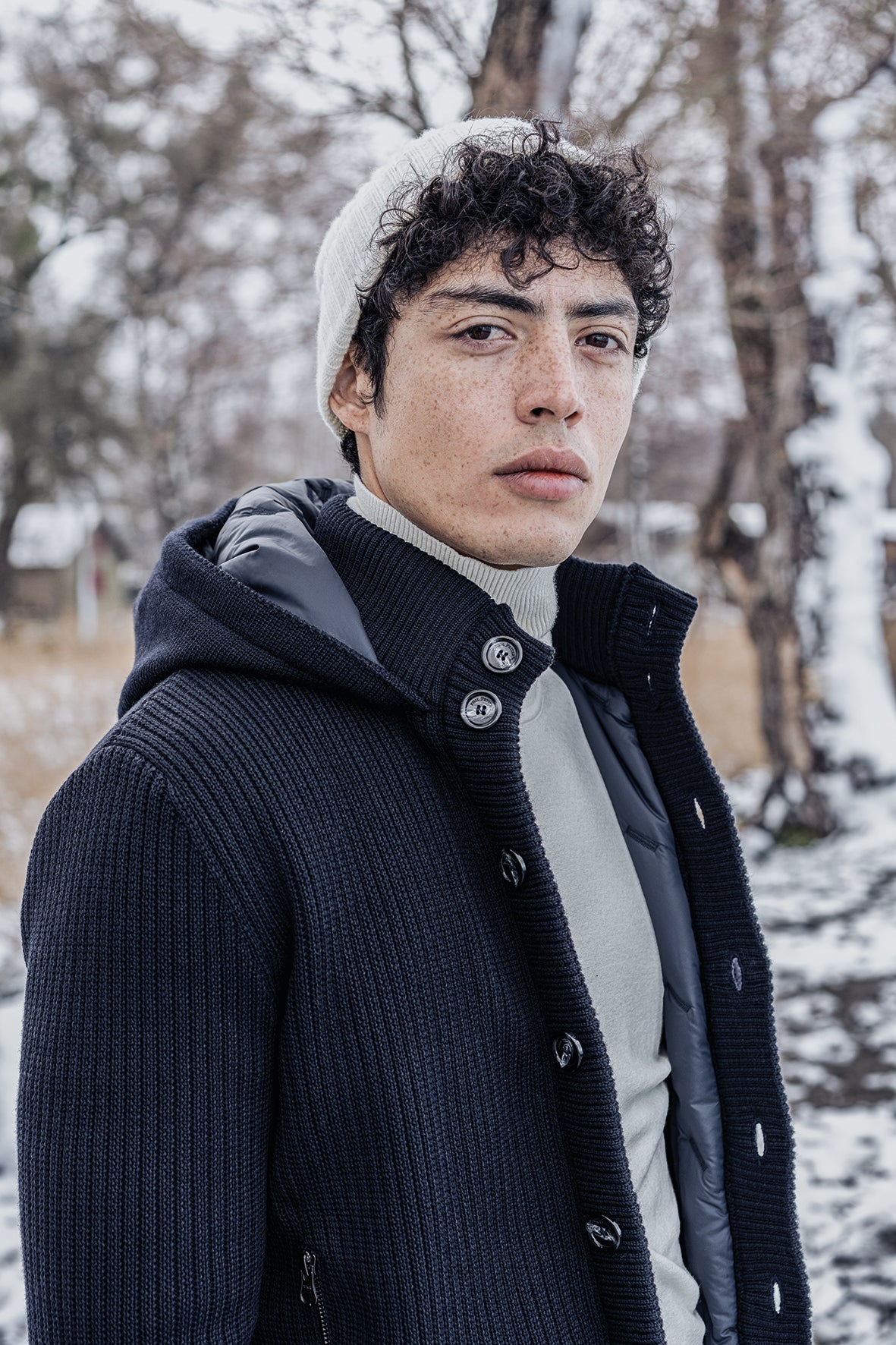 Hooded cardigan made of merino wool and quilted lining